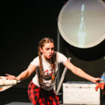 Photo of Bamboozle's AS production Moon Song. An actor flies her rocket ships to the moon.