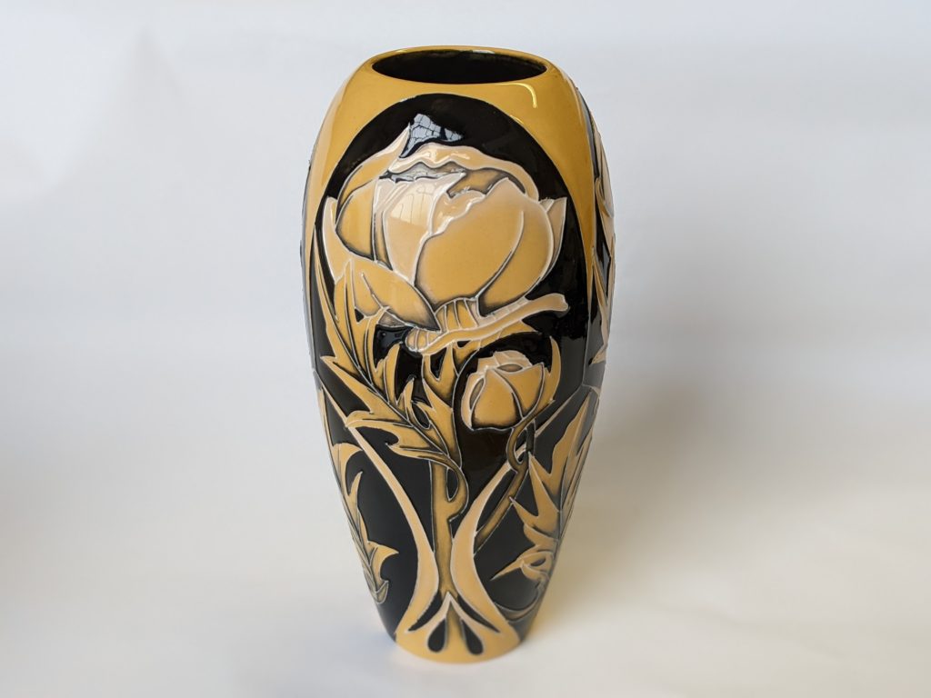 Photo of Moorcroft vase: Globeflower, a floral design in mustard yellow and black